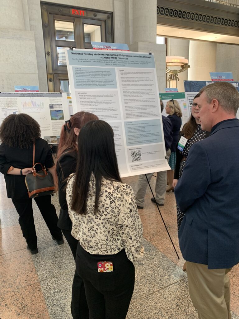 Two cITe students presenting their work to a guest